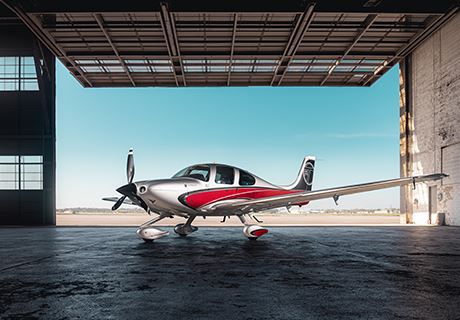 photo of Ron Wright's personal aircraft, parked in the hanger, side view